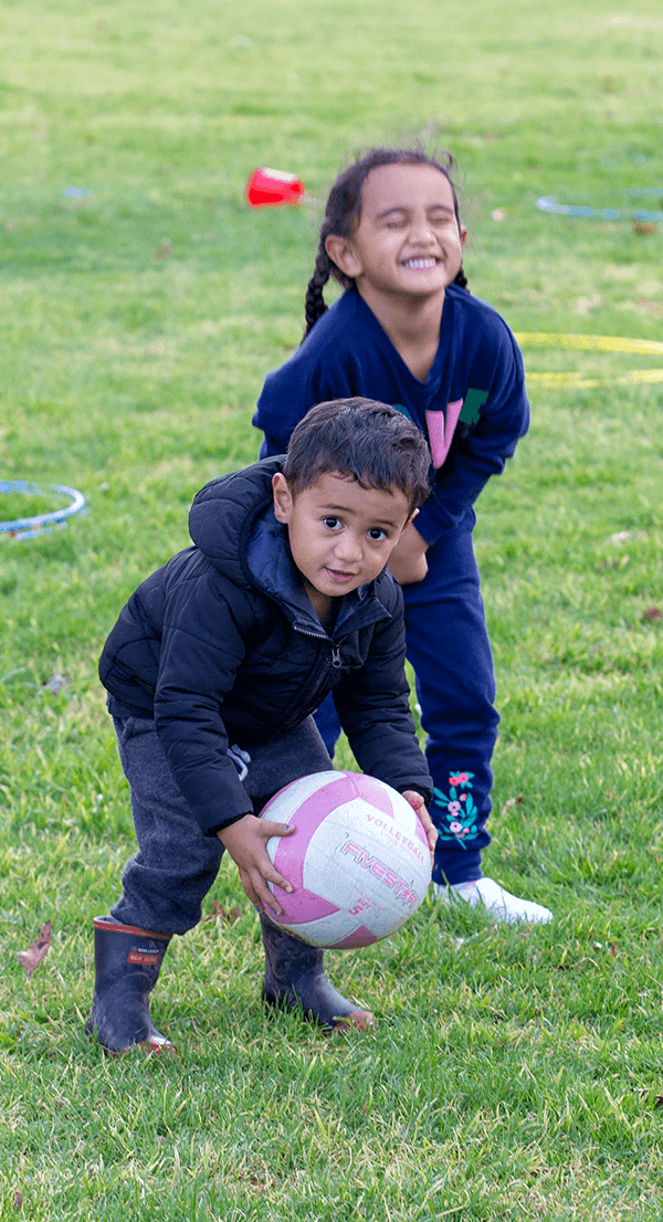 Side Image Youngboypickingupball